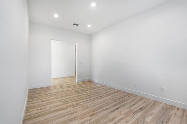 spare room with light wood-type flooring