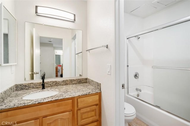 full bathroom with vanity, toilet, and enclosed tub / shower combo