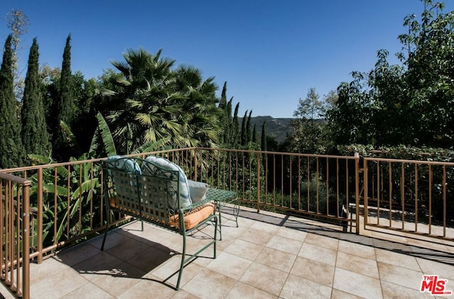 view of patio with a balcony