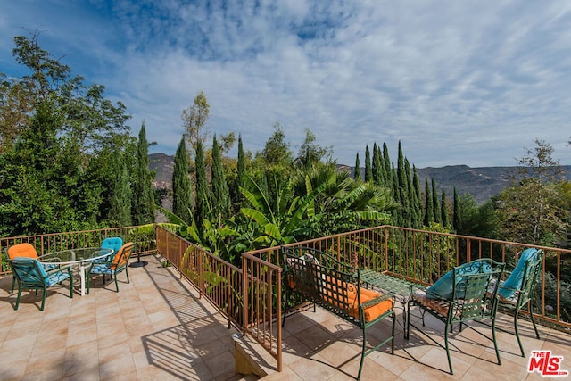 view of patio / terrace featuring a mountain view