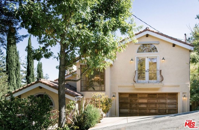 mediterranean / spanish house with a garage