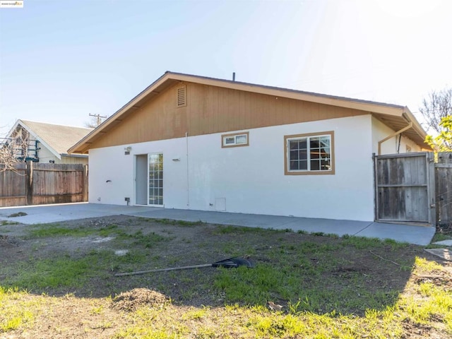 rear view of house featuring a patio