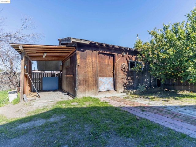 view of outdoor structure with a lawn