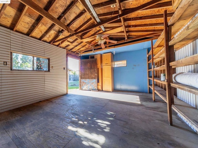 garage featuring wood walls