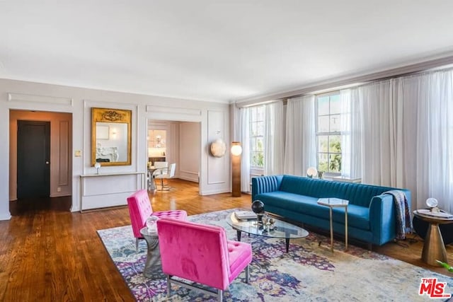 living room with dark hardwood / wood-style flooring