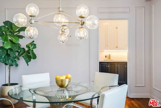 dining space with dark wood-type flooring