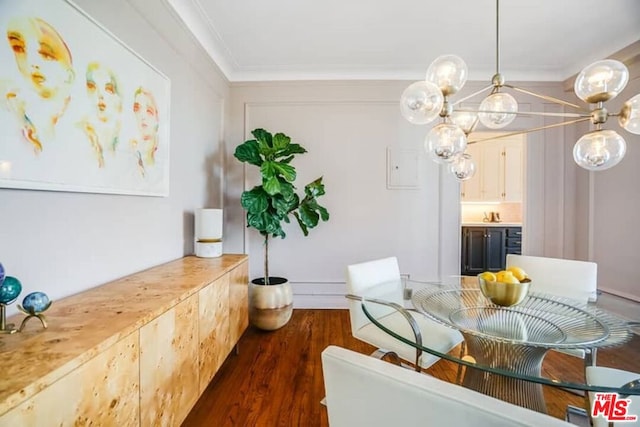 dining space with crown molding and dark hardwood / wood-style flooring