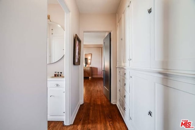 corridor featuring dark hardwood / wood-style flooring