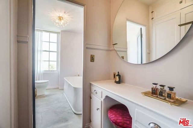 bathroom with toilet and a washtub