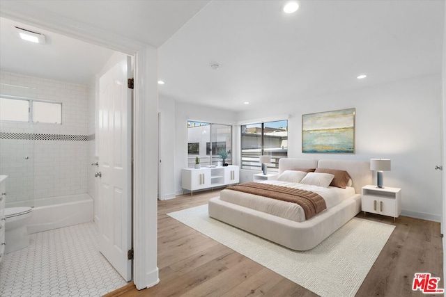 bedroom with light hardwood / wood-style floors