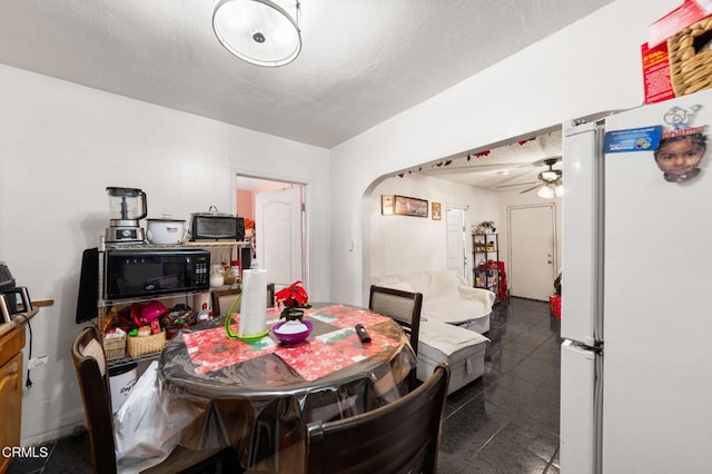 dining space featuring ceiling fan