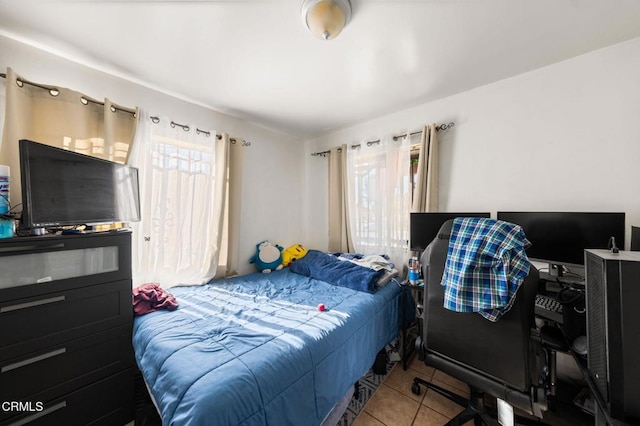 bedroom with light tile patterned floors