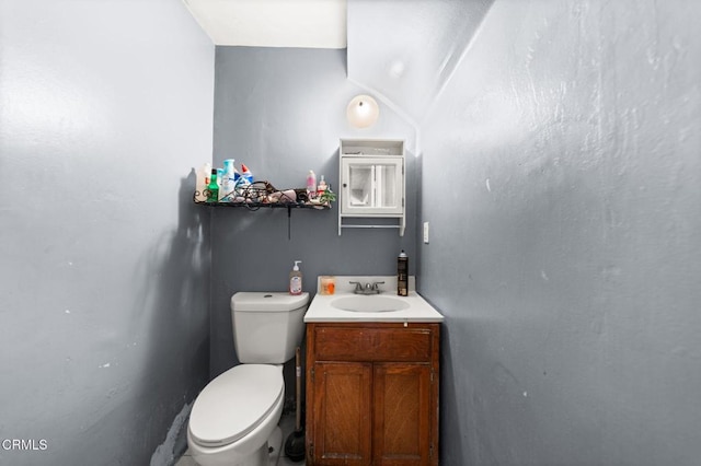 bathroom featuring toilet and vanity