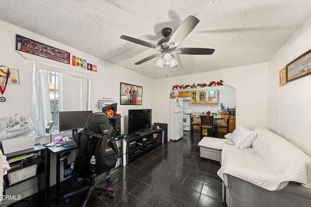 office space with ceiling fan and a textured ceiling