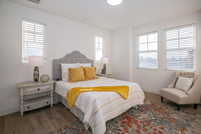 bedroom featuring dark hardwood / wood-style floors