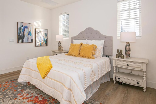 bedroom featuring dark hardwood / wood-style floors