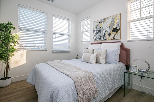 bedroom featuring wood-type flooring