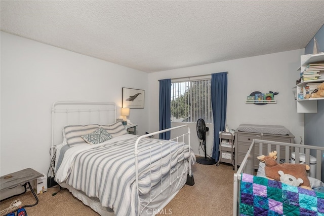 carpeted bedroom with a textured ceiling