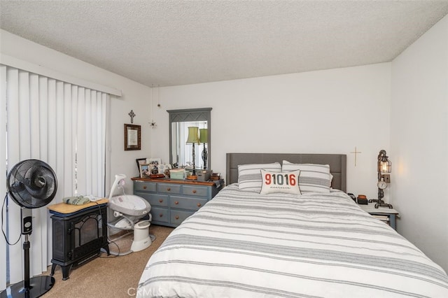 carpeted bedroom featuring a textured ceiling