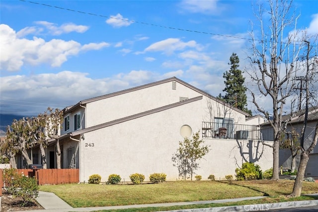 view of side of home featuring a yard