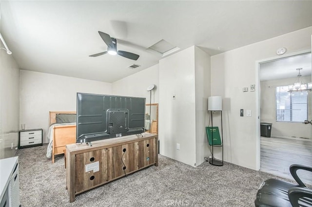 living area with carpet floors, a ceiling fan, an office area, and attic access