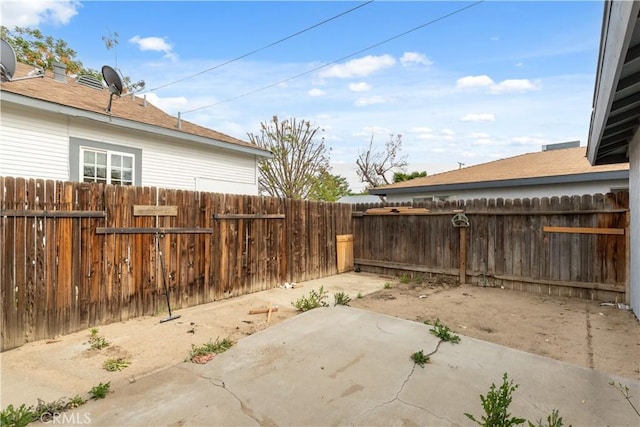 fenced backyard featuring a patio