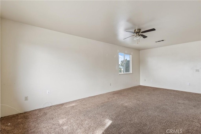 empty room with carpet and ceiling fan