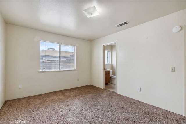 unfurnished room featuring light colored carpet