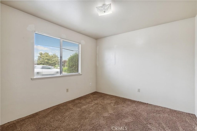 unfurnished room featuring carpet flooring