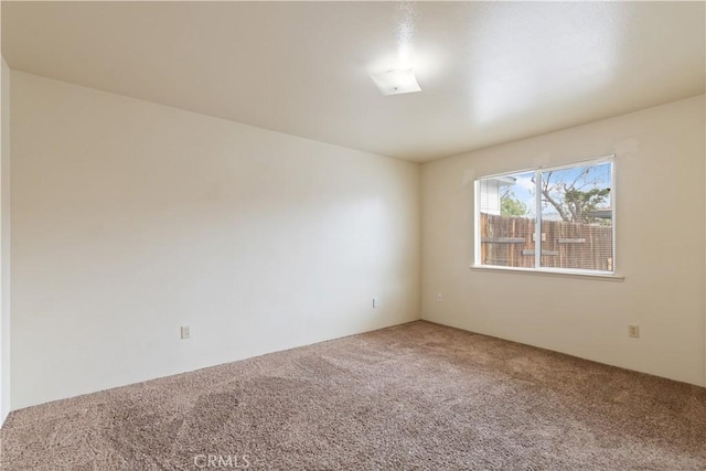 unfurnished room featuring carpet