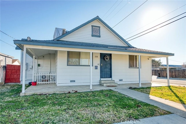 view of front of property with a porch and a front yard