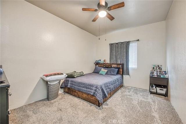 bedroom featuring ceiling fan and light carpet