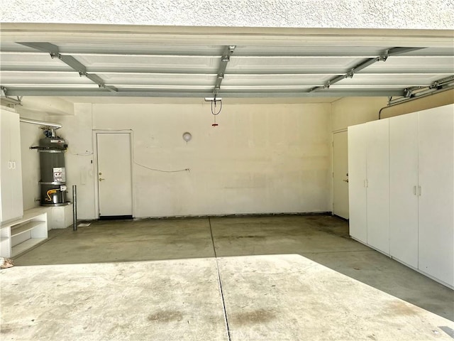 garage featuring strapped water heater