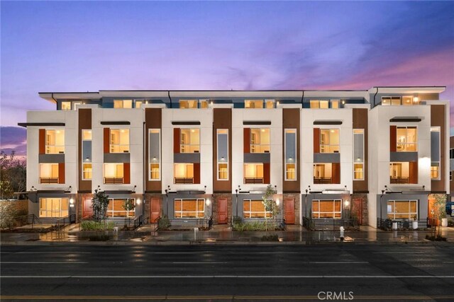 1810 E 1st St E Unit 100, Santa Ana, CA 92705 - view of property at dusk