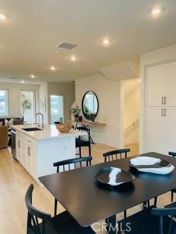 1810 E 1st St E Unit 100, Santa Ana, CA 92705 - dining space with light wood finished floors and recessed lighting