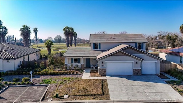 view of property featuring a porch and a garage