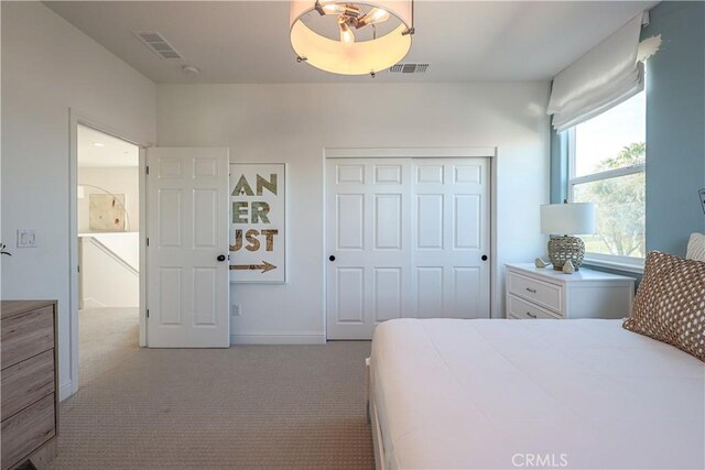 carpeted bedroom with a closet