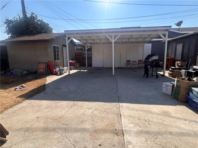 rear view of property with a carport