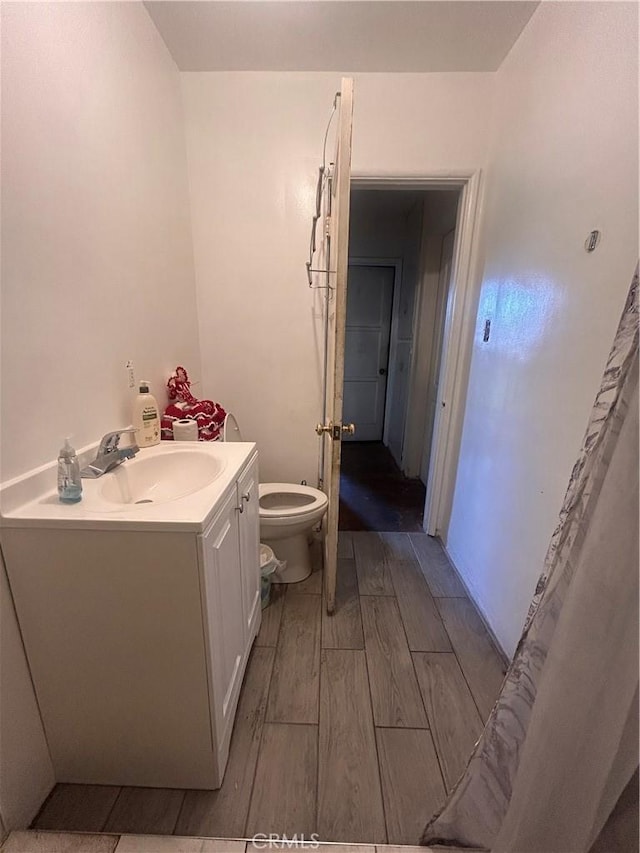 bathroom with vanity and toilet