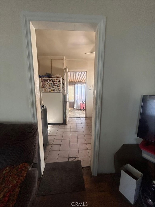 hallway with light tile patterned floors