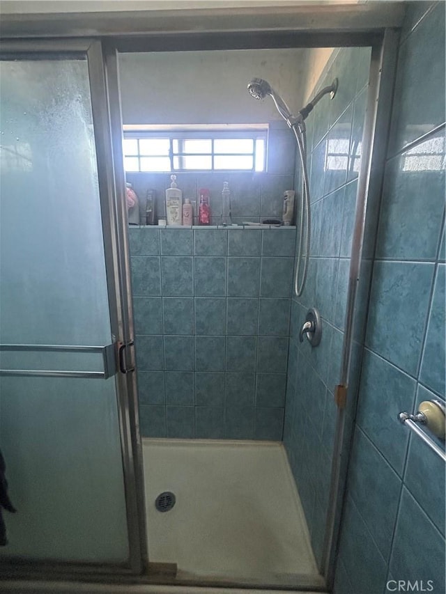 bathroom featuring an enclosed shower