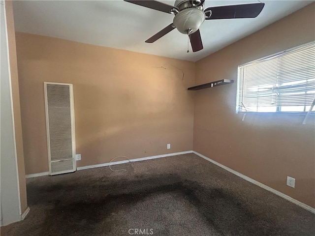 empty room with ceiling fan and carpet