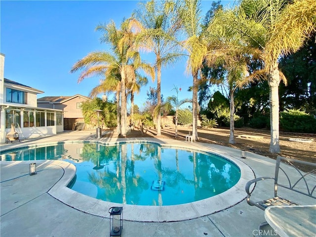 pool featuring a patio area