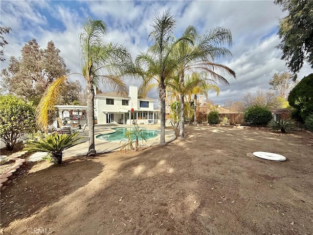 view of pool featuring fence, a fenced in pool, and a patio