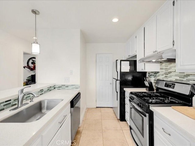 kitchen featuring sink, white cabinets, pendant lighting, and appliances with stainless steel finishes