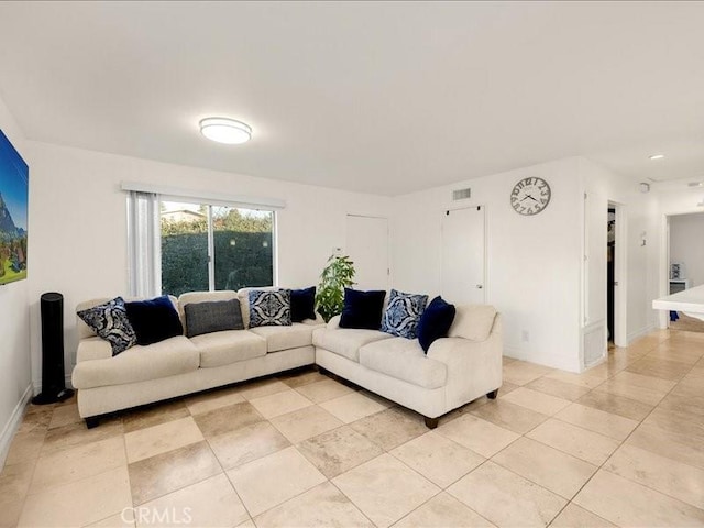 living room featuring light tile patterned flooring