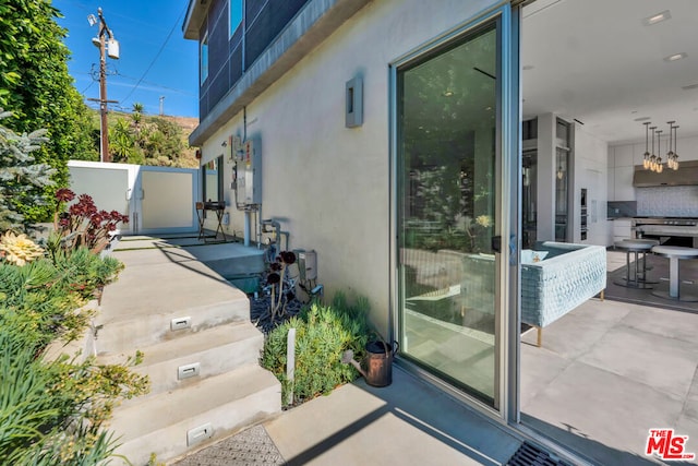 view of property exterior featuring a patio area