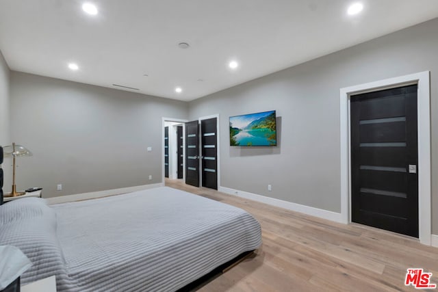 bedroom featuring light wood-type flooring