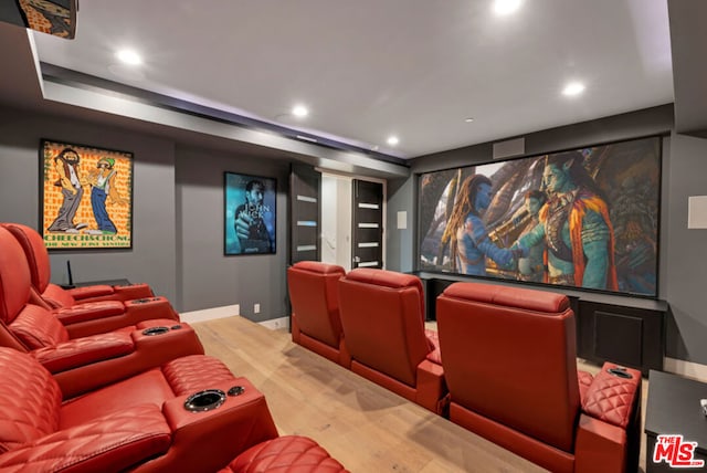 home theater room with hardwood / wood-style floors