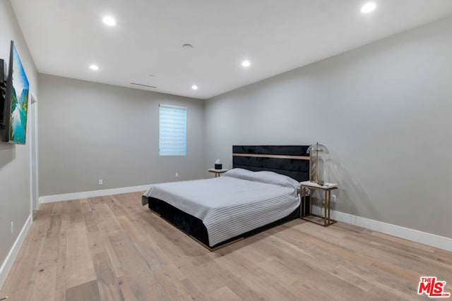 bedroom featuring light wood-type flooring